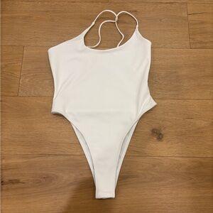 ASYMMETRICAL BODYSUIT